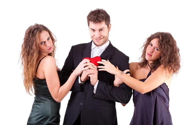 Handsome Man with two Women Flirting Stock Image