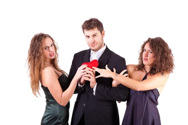 Handsome Man with two Women Flirting Stock Picture