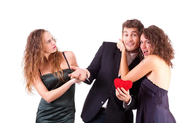 Handsome Man with two Women Flirting Royalty Free Stock Photos