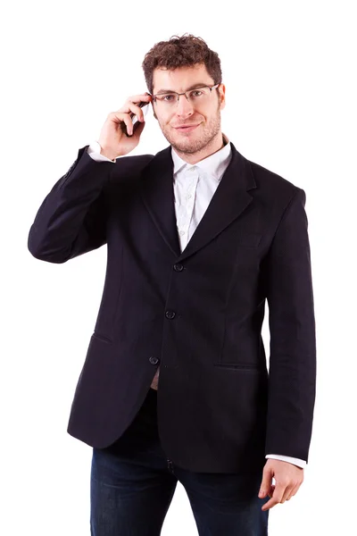Mladý podnikatel s smartphone na bílém pozadí — Stock fotografie