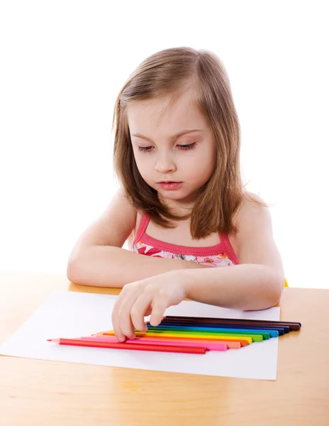 Little Girl chosing pencil — Stock Photo, Image