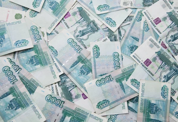 Achtergrond van duizend Russische roebel facturen — Stockfoto