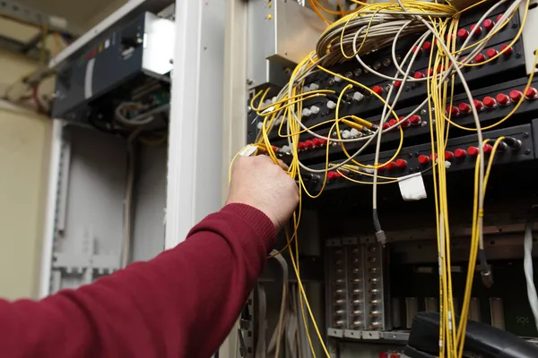 Stock image Telecom engineer connecting fiber optic