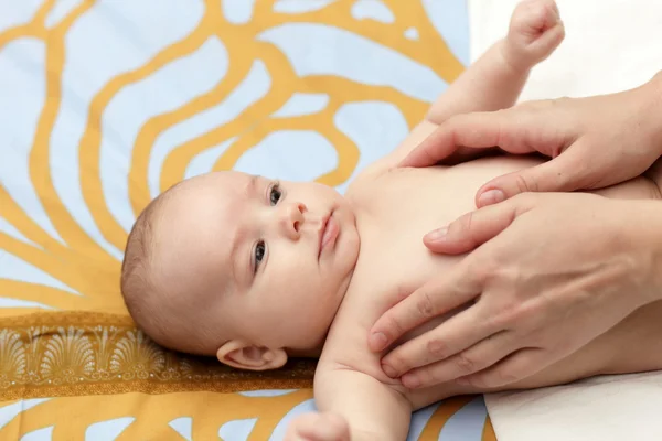 Massaging baby — Stock Photo, Image