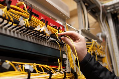 Technician attaching fiber optic clipart