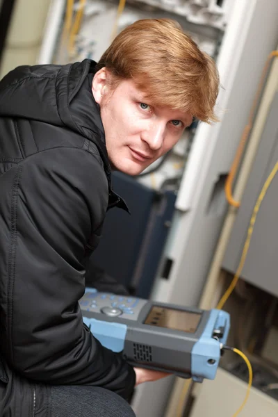 Portrait of technician with reflectometer — Stock Photo, Image