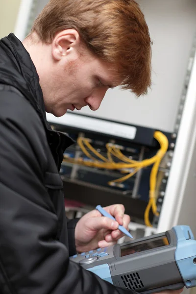 Technician adjusting telecom instrument — Stock Photo, Image