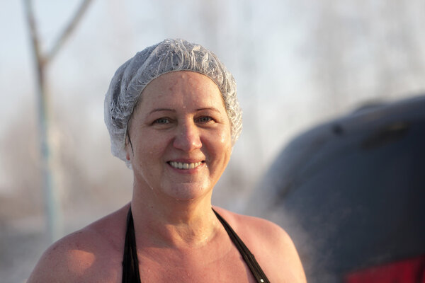 Happy woman after winter swimming