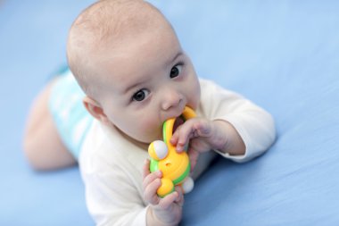 Baby with rattle clipart