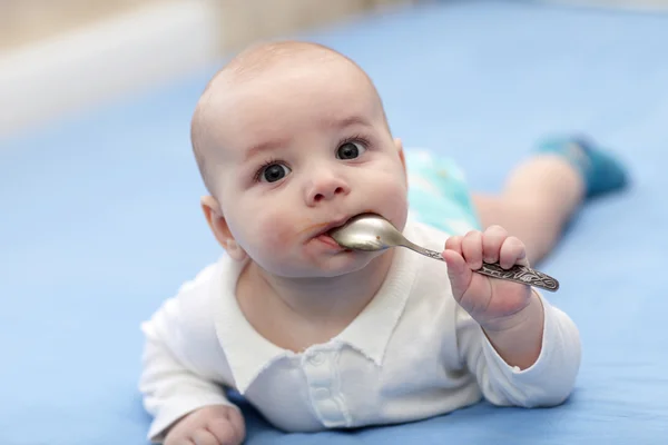 Baby boy with spoon — Stock Photo, Image
