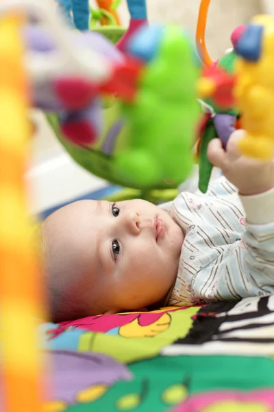 Baby on playing mat — Stock Photo, Image