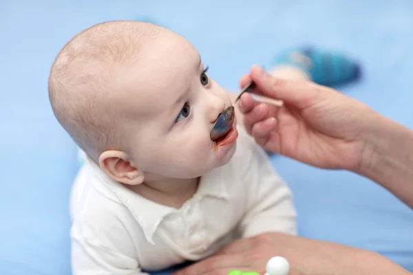 Baby taking a medicine — Stock Photo, Image