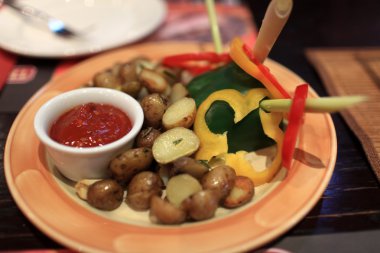 Plate with baked potatoes