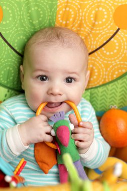 Baby biting rattle clipart