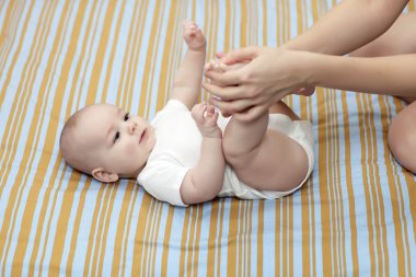 Massaging of baby foot clipart