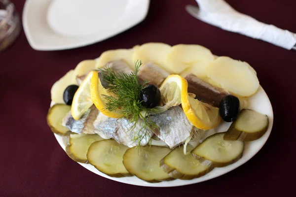 Pickled herring and cucumbers — Stock Photo, Image