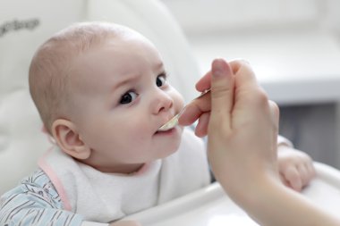 Feeding of child clipart