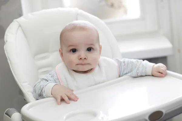 Baby in highchair — Stock Photo, Image
