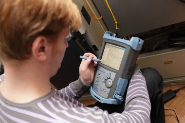 Engineer setting reflectometer clipart