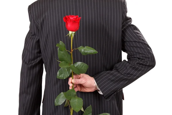 Людина з червоною трояндою — стокове фото