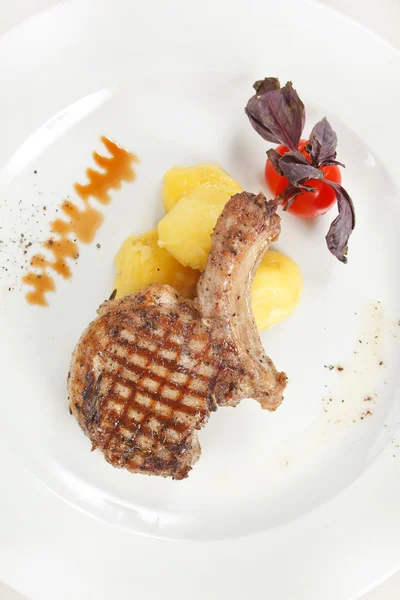 Steak served with potatoes — Stock Photo, Image