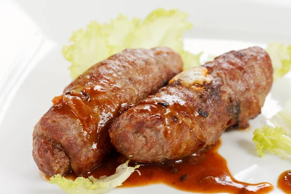 Grilled sausages with sauce — Stock Photo, Image