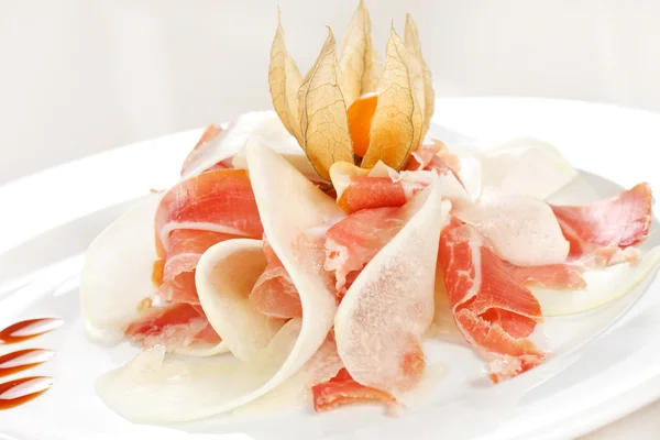 Spanish serrano ham with melon — Stock Photo, Image