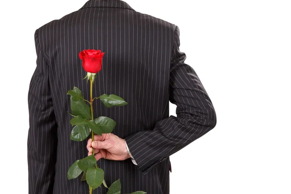 Muž s červenou růží — Stock fotografie