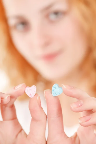 Woman with heart sweets — Stock Photo, Image