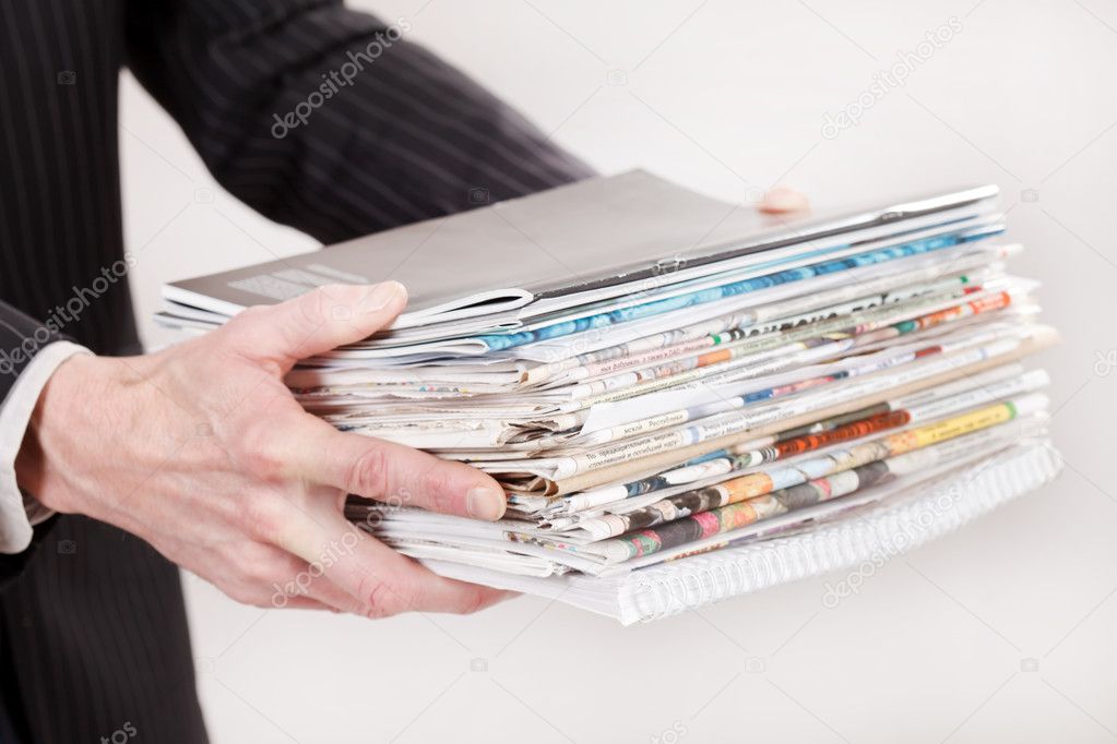 Businessman with stack of paper
