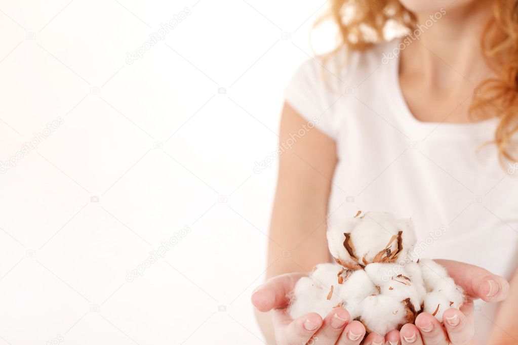Young woman with cotton flowers