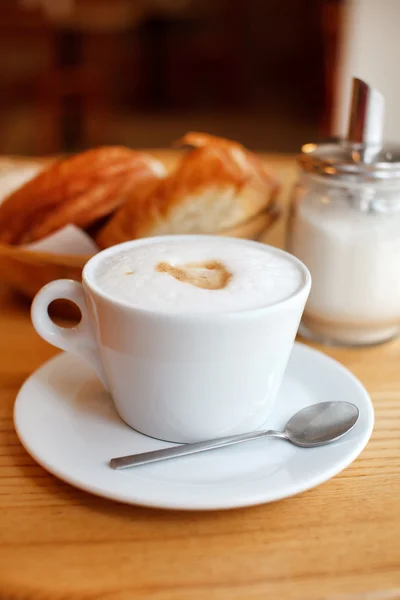 Cup of coffee with croissants — Stock Photo, Image