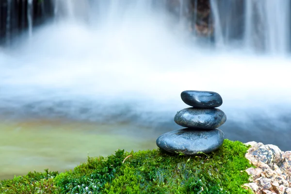 stock image Pebble stones over waterfall