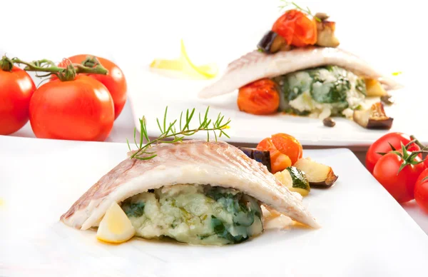 Fish filet on potato with chard — Stock Photo, Image