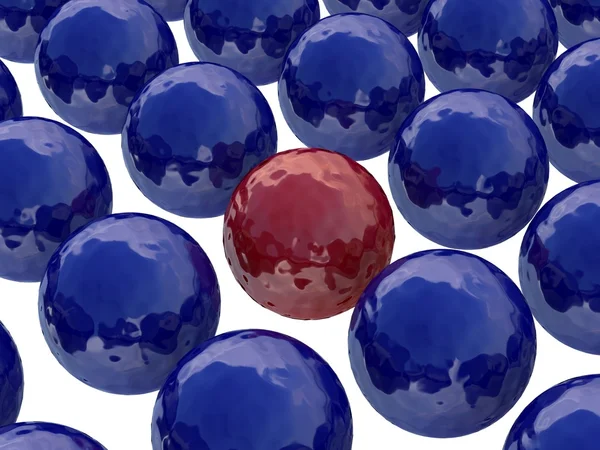 Rode bal onder donkere blauwe ballen — Stockfoto