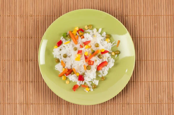 Rice with peas, corn, and red peppers — Stock Photo, Image