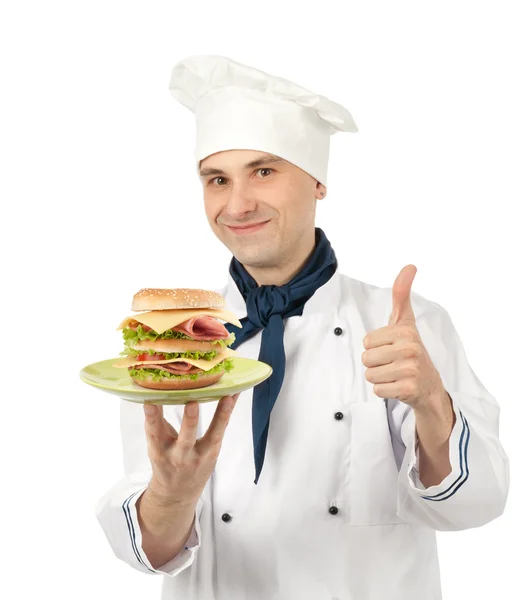 Chef-kok houden een plaat met grote sandwich — Stockfoto