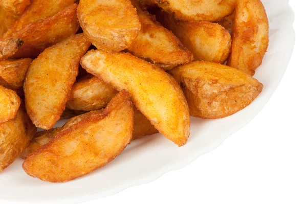 Fried potato wedges isolated on white background — Stock Photo, Image