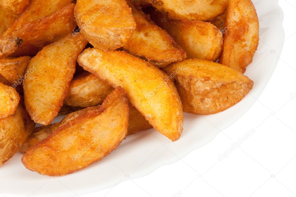 Fried potato wedges isolated on white background