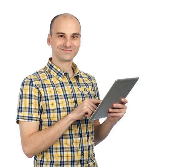 Yakışıklı bir adam bir tablet bilgisayar kullanma — Stok fotoğraf