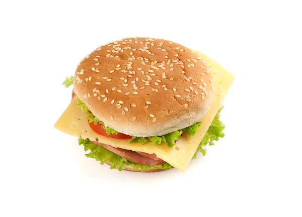 Velké rychlé občerstvení sendvič s hlávkovým salátem, šunkou, sýrem a rajčaty — Stock fotografie