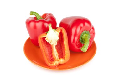 Red sweet pepper on a plate clipart