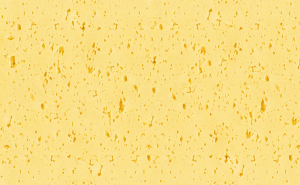 Hintergrund von gelbem Schweizer Käse mit Löchern — Stockfoto