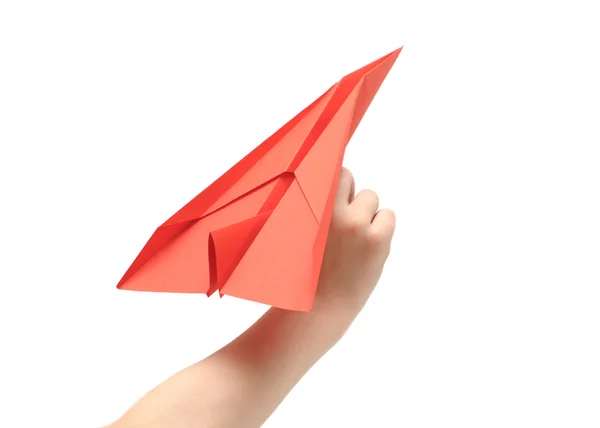 La main de l'enfant lance l'avion en papier — Photo