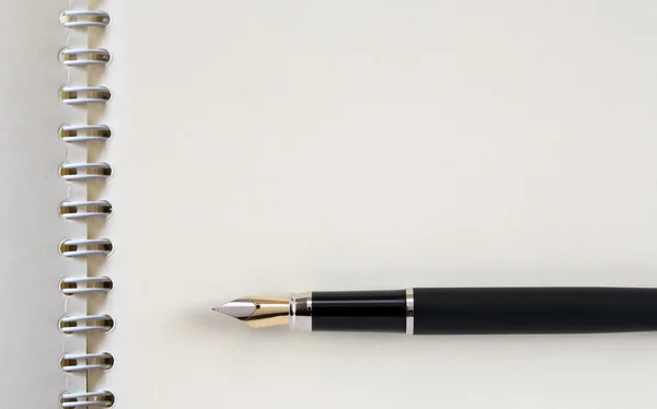 Pen op notebook — Stockfoto