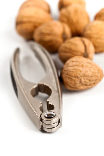 Walnuts and nutcracker — Stock Photo, Image