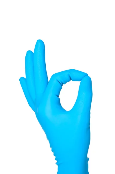 Hand in blauem Handschuh ok Zeichen isoliert auf weißem Hintergrund. — Stockfoto