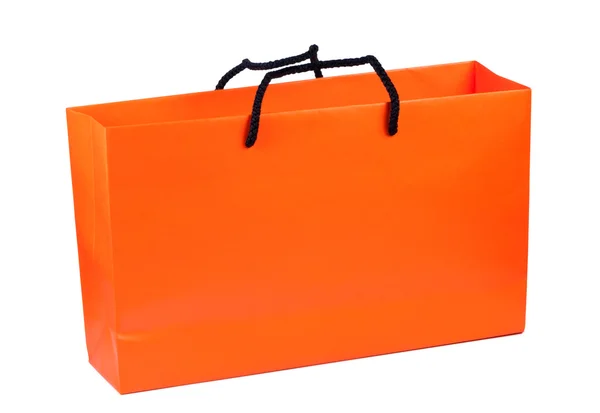 Bolso de papel color naranja brillante aislado sobre fondo blanco . —  Fotos de Stock