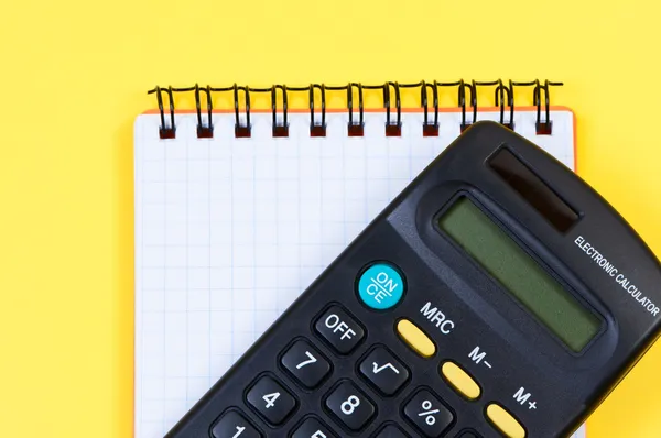 Kalkulator i notatnik szczegół widok powyżej. — Zdjęcie stockowe