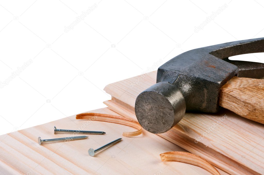 Hammer and nails on boards. Concept building and repairing.